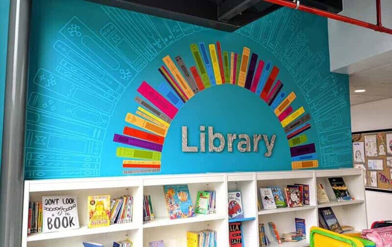 An image of a curved bookshelf wall graphic.